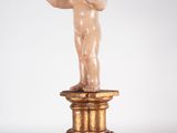 an image of a statue of a child on a pedestal