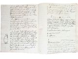 un vieux livre écrit posé sur une table