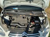 a car that has its hood open and the engine in it