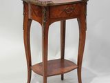 an old wooden table with a drawer on top of it