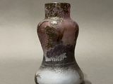 a small vase that is sitting on a table