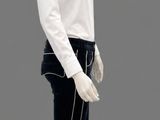 a mannequin dressed in a white shirt and black pants