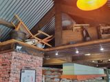 an image of a restaurant with a brick wall and ceiling