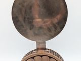 an image of a metal object with a circular design on it
