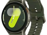 a smart watch with a green strap on it