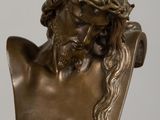 bronze bust of a man with a crown of thorns on his head