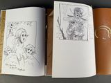 an open book with a drawing of a woman and a man