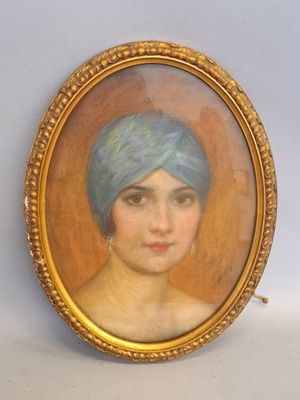 painting of a woman with a blue turban in a gold frame