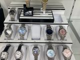 a lot of watches on display in a display case