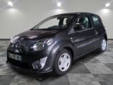 a picture of a small black car parked on a checkered floor