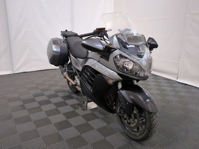 a motorcycle that is parked on a checkered floor