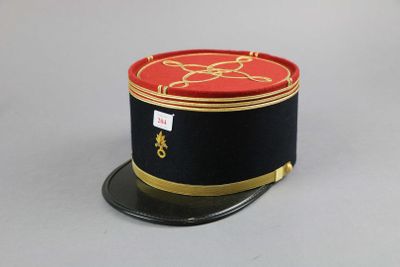 a black hat with a red and gold design on it