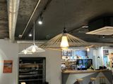 a restaurant with tables and benches in the middle of the room
