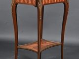 a small table with a marble top on a wooden stand