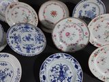 a lot of plates that are sitting on a table