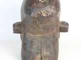 a wooden sculpture of a man with a hat on