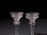 pair of crystal wine glasses on a black background