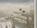 painting of two birds flying over a city and a river