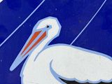a blue and white sign with a pelican on it