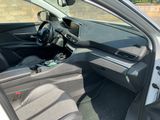 the interior of a car with the door open showing the steering wheel and dashboard