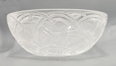 a glass bowl that is sitting on a table