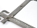 a large metal sword with a chain around it