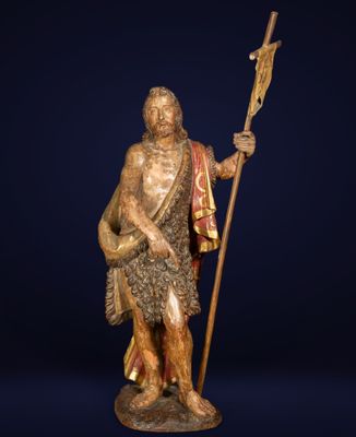a bronze statue of a man holding a spear and shield