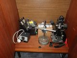 a small table with a microscope on it in a room