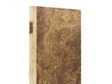an old book with a brown cover and a wooden cover