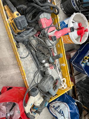 a box full of assorted tools on the floor