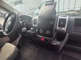 a dashboard of a truck with a steering wheel and dashboard controls