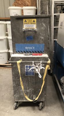 a machine that is sitting next to some buckets