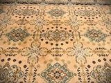 an image of a large oriental rug on a wooden floor