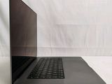 a laptop that is sitting on a white surface