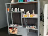 a shelf with many different types of hair products on it