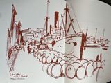a book with a drawing of a boat in a harbor
