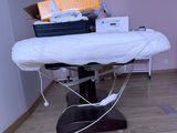 a table with a white sheet on it in a room