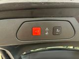 a red button on the door handle of a car