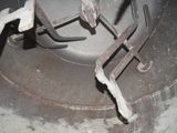 a close up of a metal object with a wren on it
