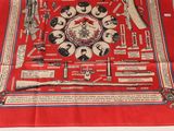 an image of a red scarf with a picture of various items on it