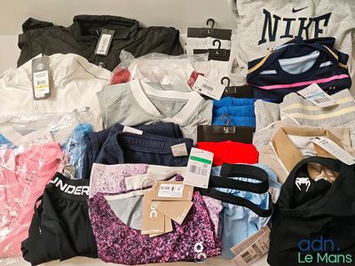 a lot of clothes that are sitting on a table