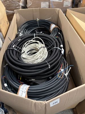 a box full of black and white wires and wires