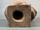 a clay object with a hole in the middle of it