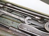 many wrenches that are sitting in a box