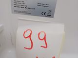 a note taped to the side of a refrigerator with a price tag