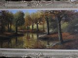 une photo d'un tableau représentant une rivière dans les bois