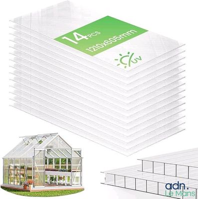 a stack of clear plastic greenhouse boxes with a logo on them