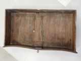 an old wooden box with a handle on it
