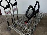 three black and silver shopping carts sitting in a garage