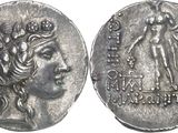 a close up of a silver coin with a woman on it
